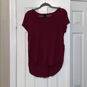 Soft high low tee with slits on the side.